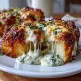 Creamy Au Gratin Potatoes: Layers of tender potatoes baked in rich cream sauce with golden, bubbly Gruyère cheese.