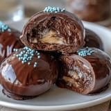 Rich chocolate-dipped peanut butter Easter eggs, decorated with colorful sprinkles for a fun holiday treat.