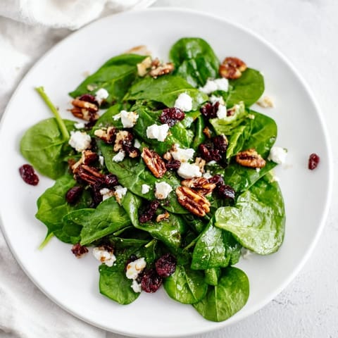 Juicy dried cranberries and a tangy balsamic vinaigrette add sweet-tart balance to this fresh Spinach Goat Cheese Salad.