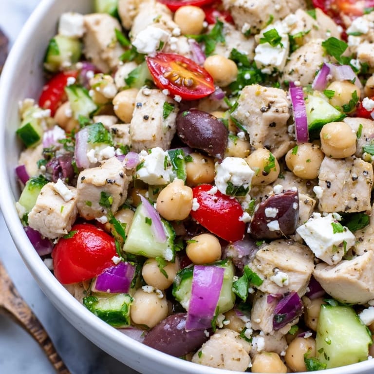 Fresh Mediterranean Chickpea Chicken Salad featuring crisp cucumber, cherry tomatoes, and parsley tossed in a zesty lemon dressing.  