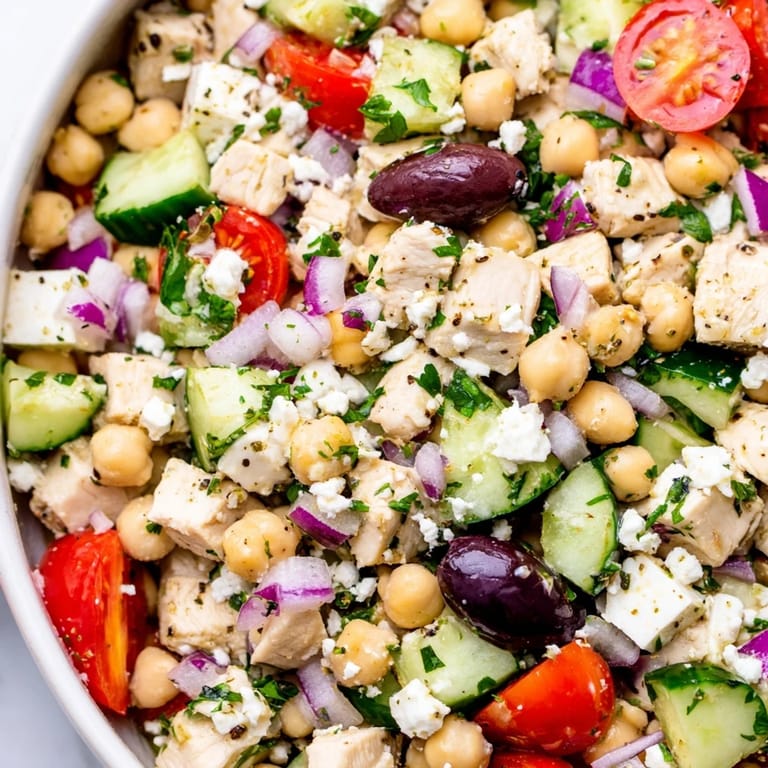 Healthy Mediterranean Chickpea Chicken Salad served over mixed greens, ready for a light lunch or easy dinner.